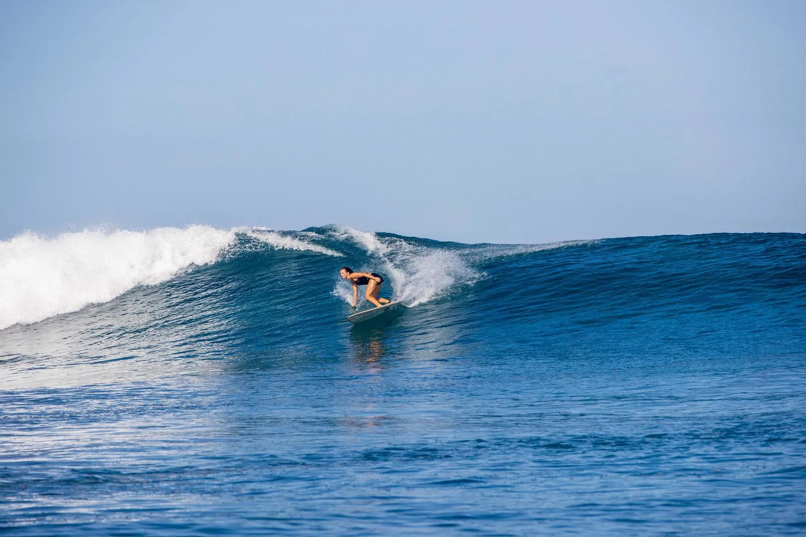 Beginner surf lesson on the sandy bottom at El Anclote