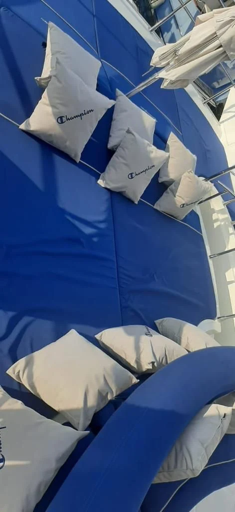 Blue cushioned lounge seating aboard the yacht