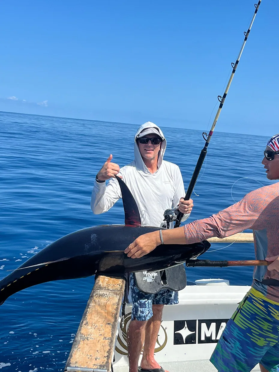 Inshore catch held up beside the boat rail