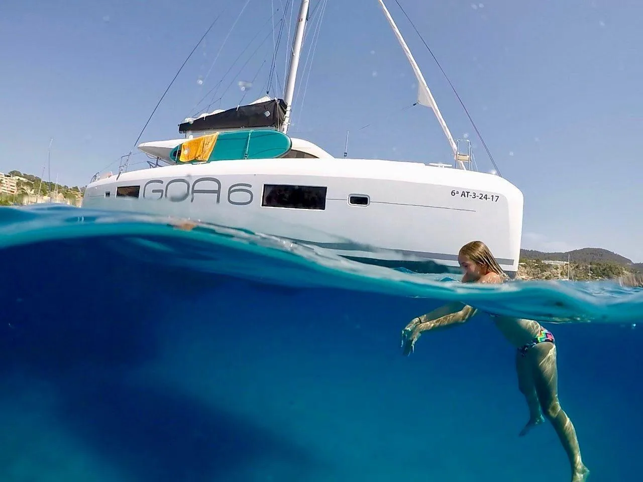 Snorkeling from the catamaran in clear bay water